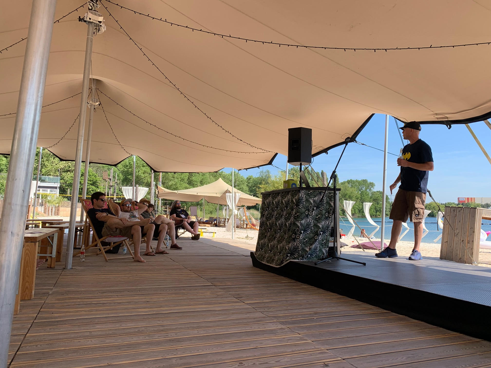 Speakers talking under a tent